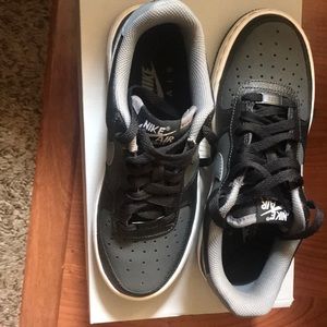 Black gray and white Nikes air force one